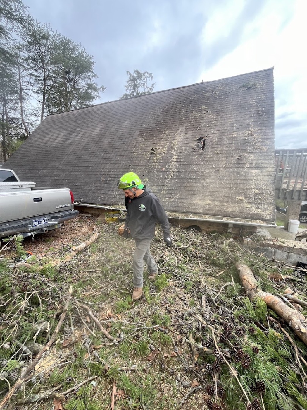 The crew removing a tree that came down over a house in Powell